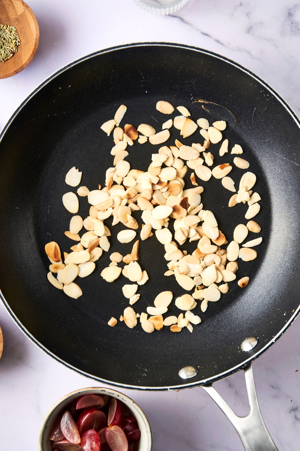 Toasted almonds in a pan.