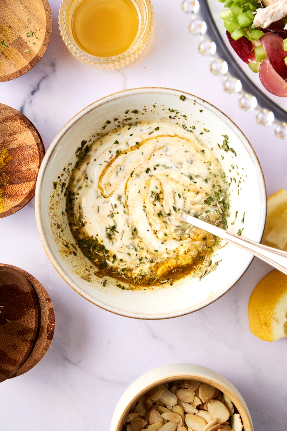 A mixed dressing in a white bowl.